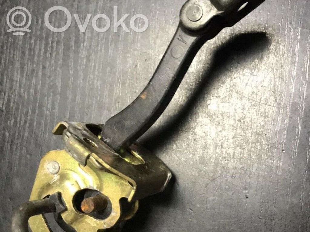 Front door check strap stopper   8160959