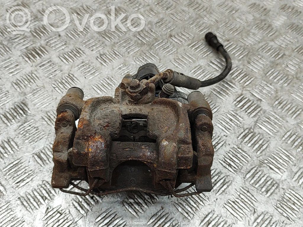 Volkswagen Golf VII Tylny zacisk hamulcowy 