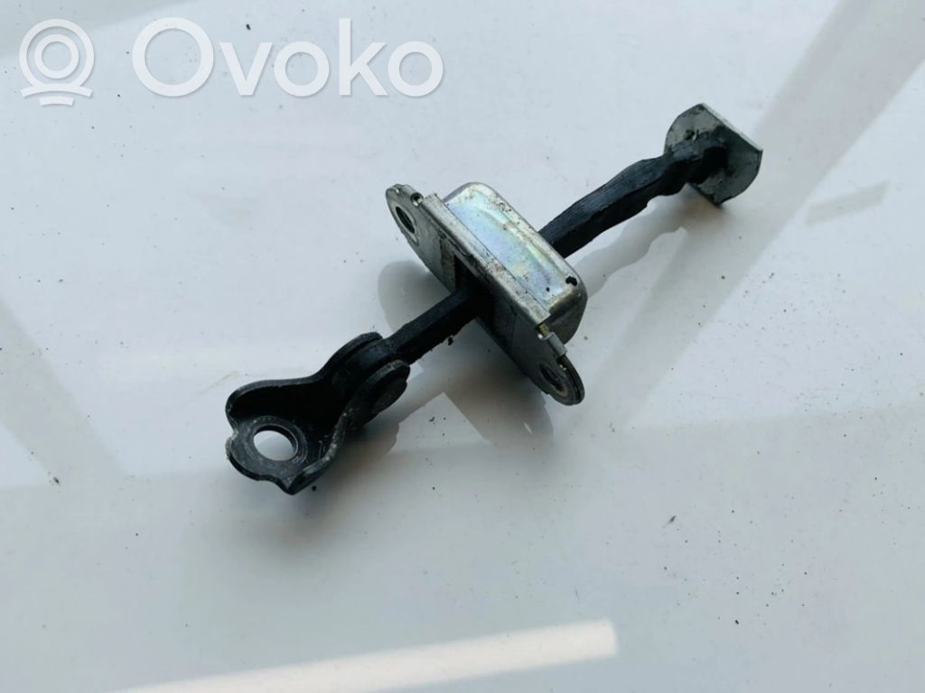 Rear door check strap stopper