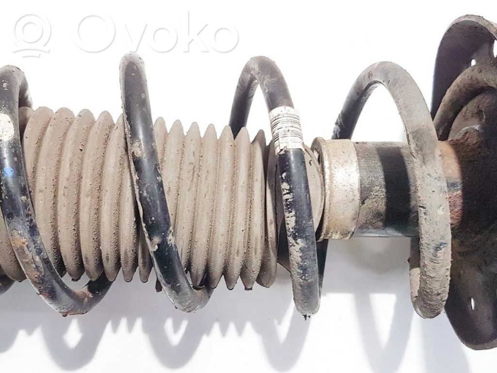 Opel Corsa D Muelle espiral delantero 