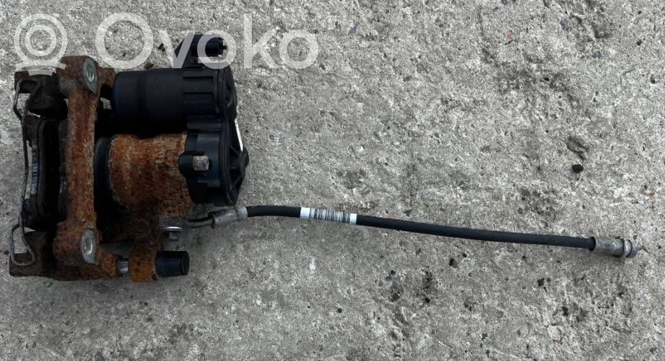 Ford Escape IV Tylny zacisk hamulcowy 