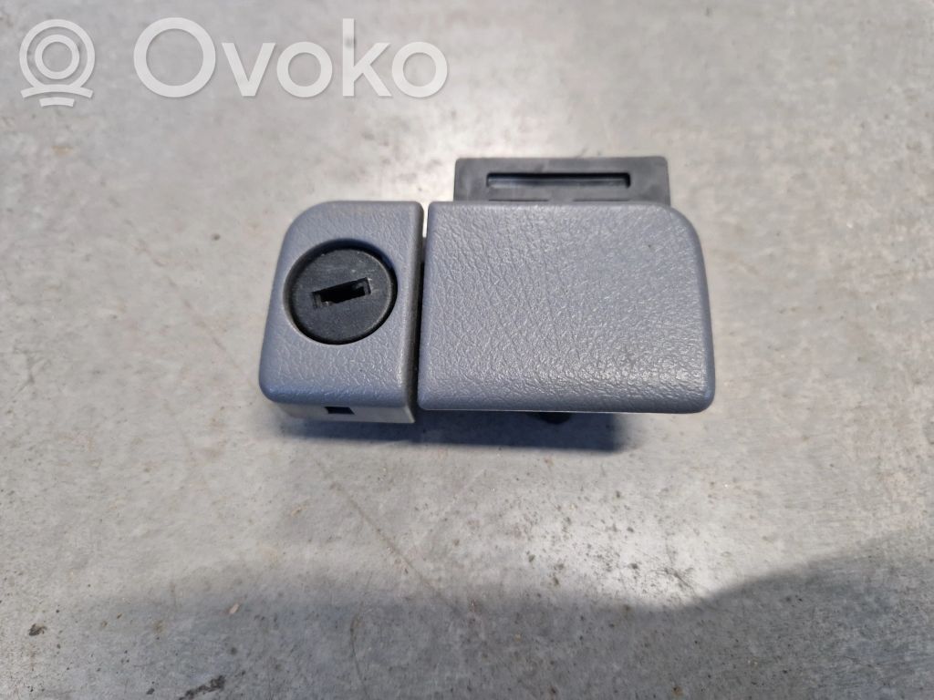Glove box opening button