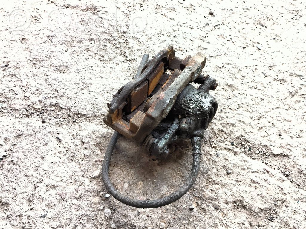 Peugeot 208 I Front brake caliper 