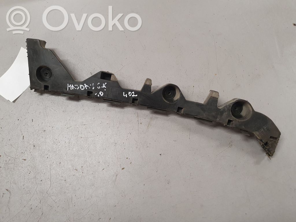 Mazda 6 Uchwyt / Mocowanie zderzaka tylnego 