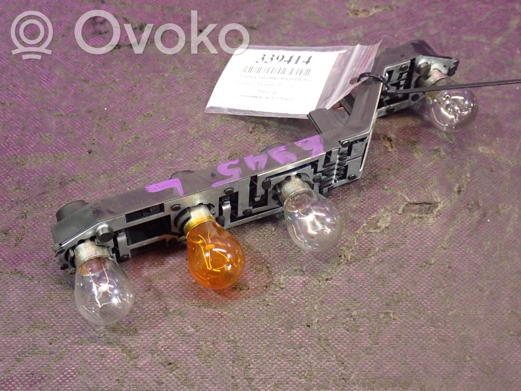 AC 428 Takavalon polttimon suojan pidike 