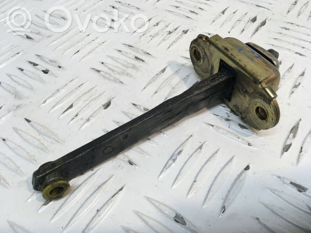 Front door check strap stopper