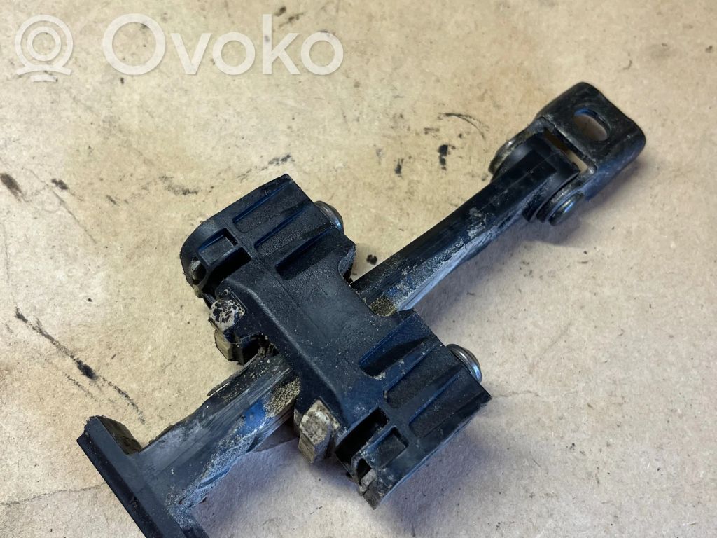 Front door check strap stopper   7070333