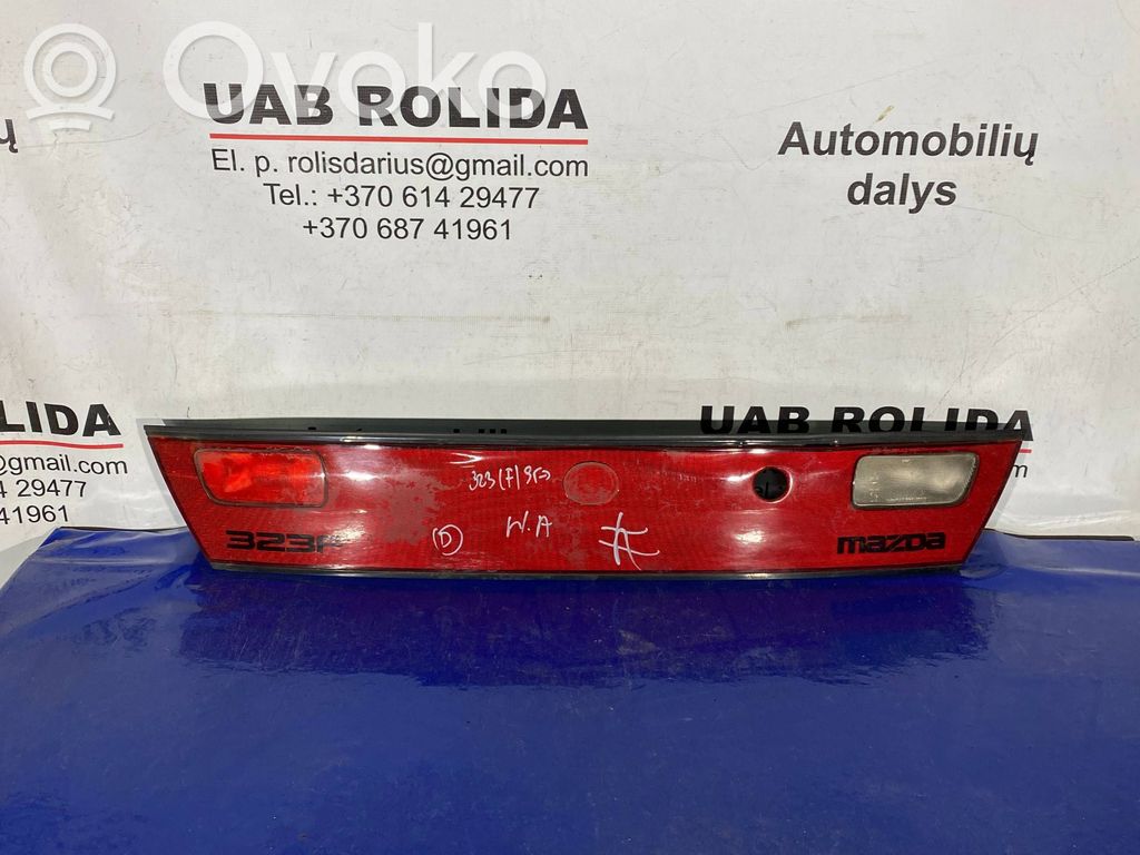Mazda 323 Trunk door license plate light bar 