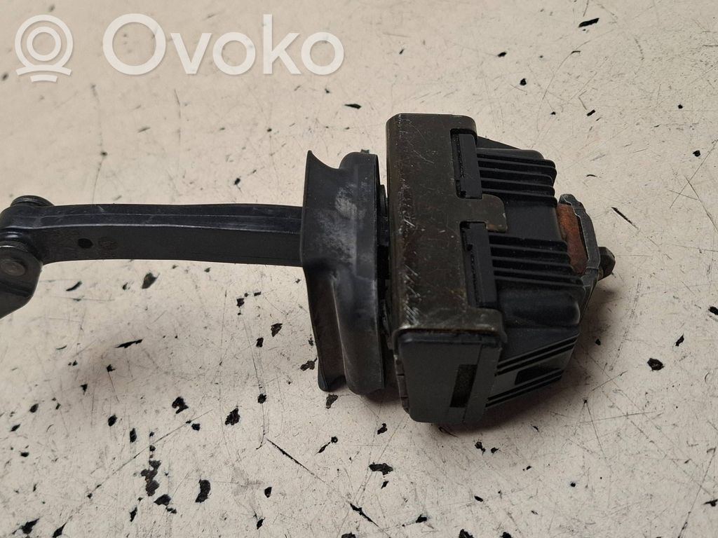 Front door check strap stopper   7033609