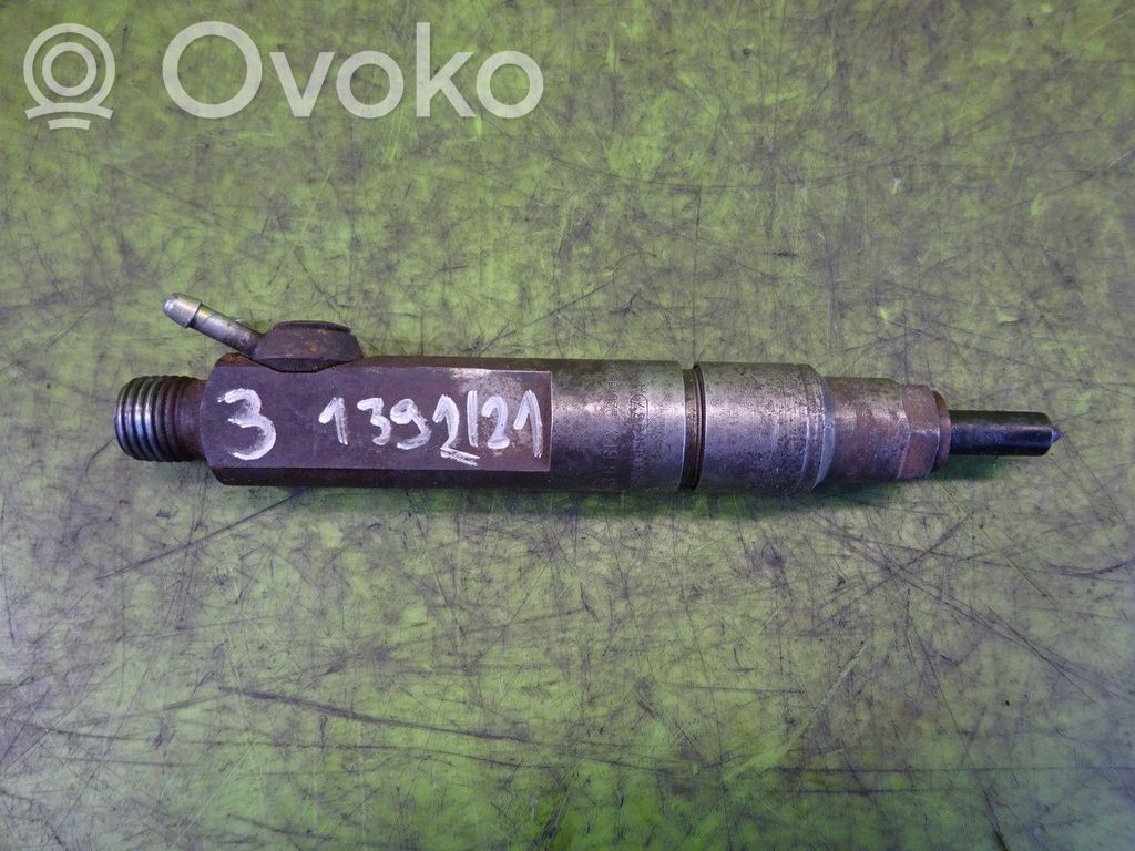 Inyector de combustible   074130203B