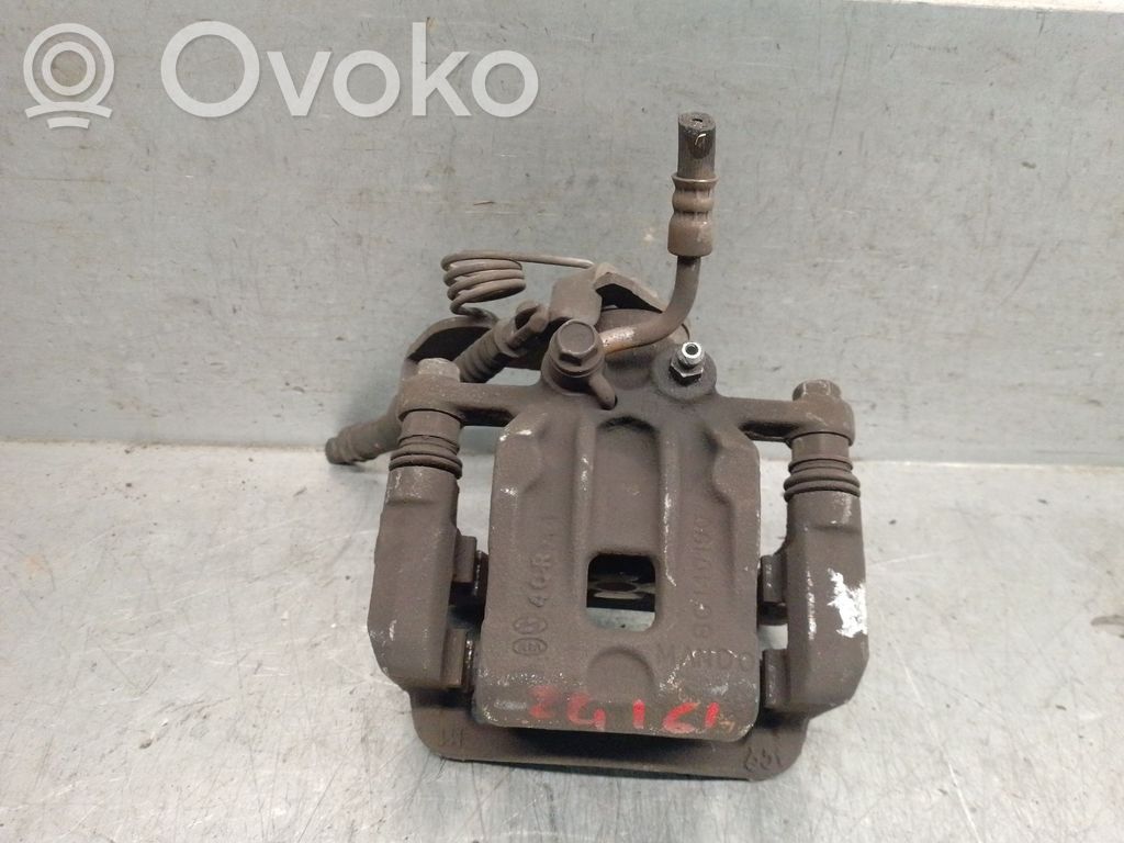 KIA Carens III Mocowanie / Zacisk hamulca tylnego 