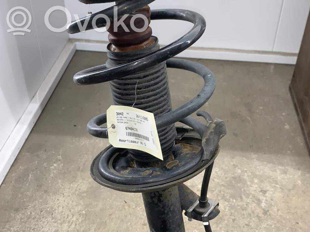 Front shock absorber with coil spring