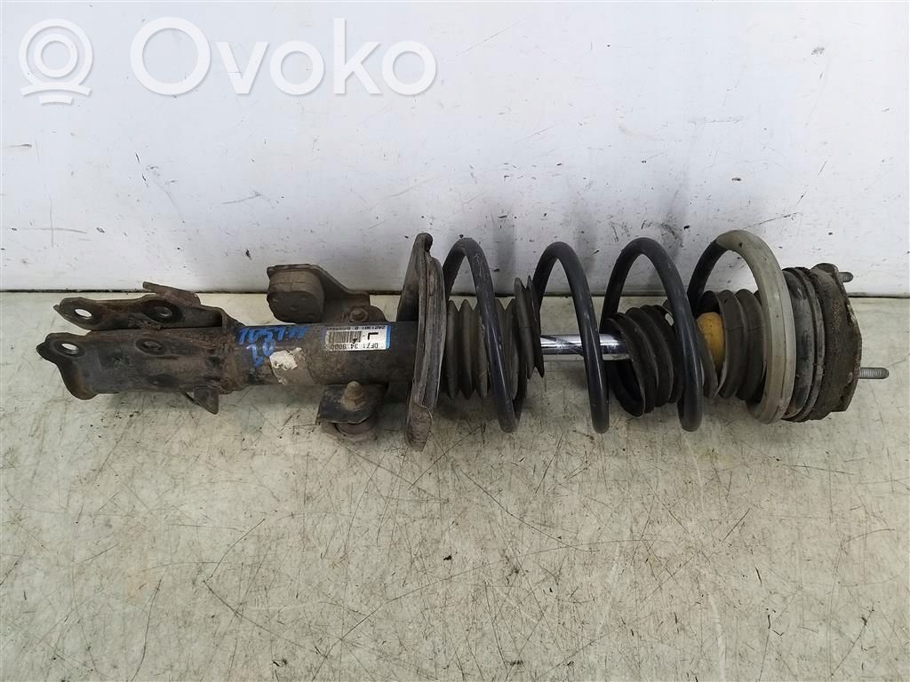 Front shock absorber with coil spring
