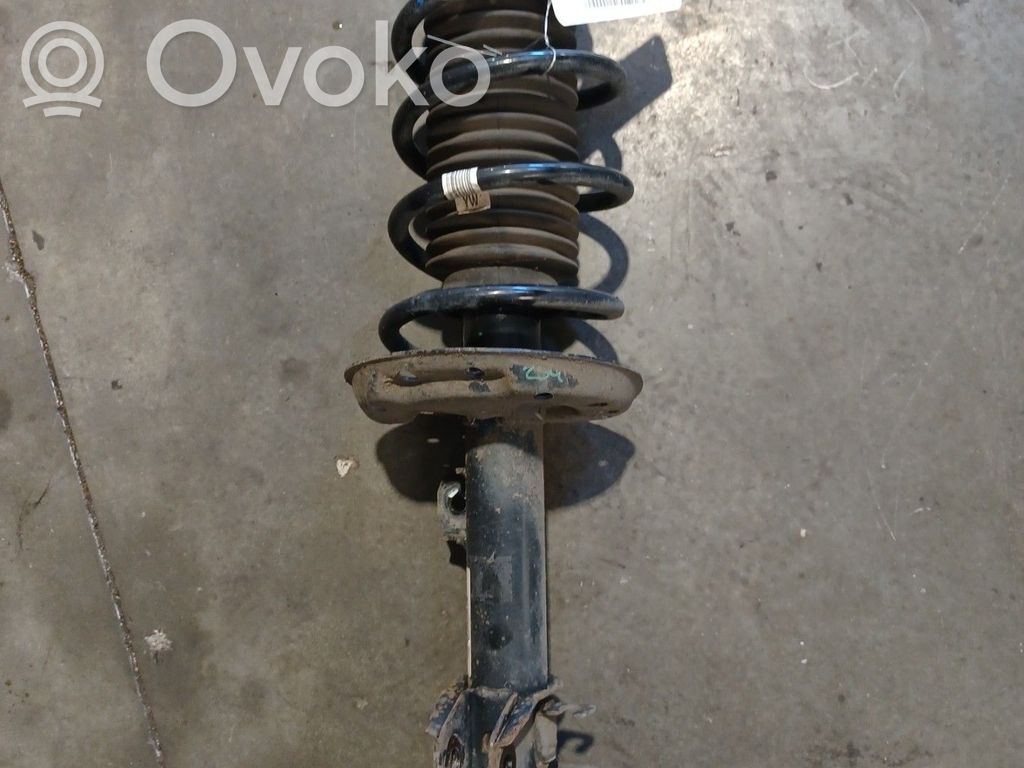 Opel Corsa D Etuiskunvaimennin kierrejousella 