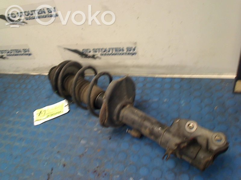 Front shock absorber with coil spring