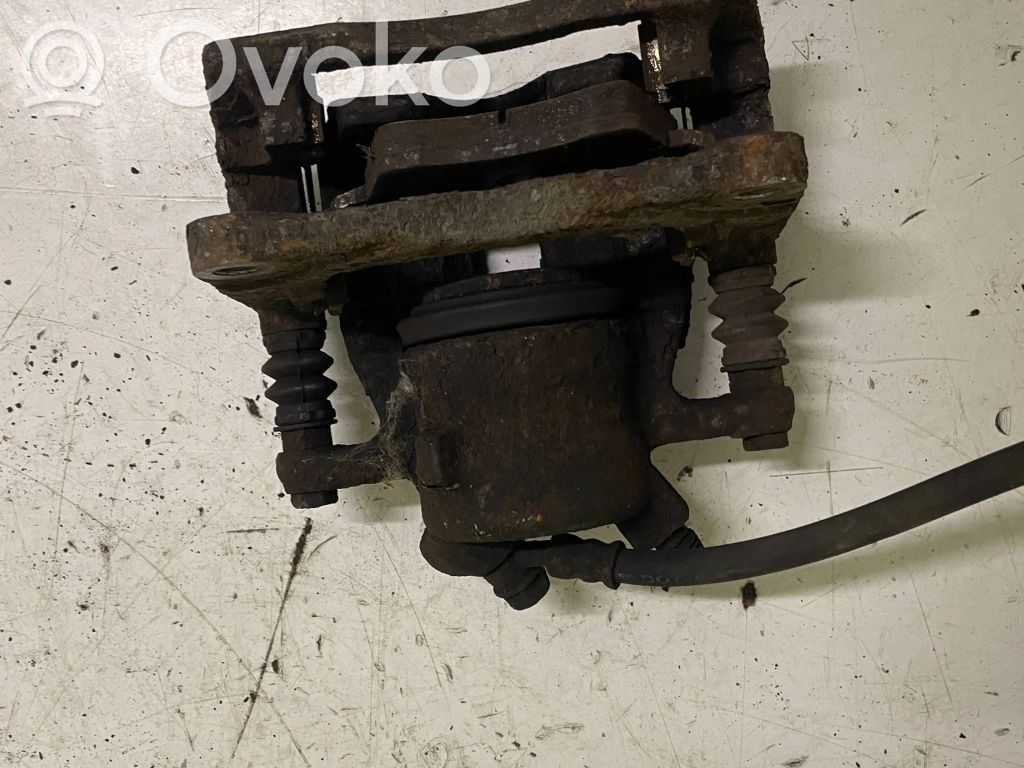 Suzuki Swift I Front brake caliper 