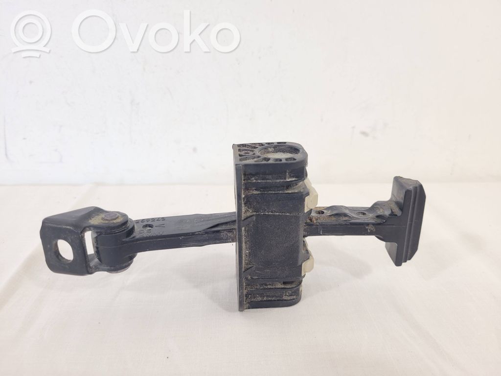 Front door check strap stopper   7259243