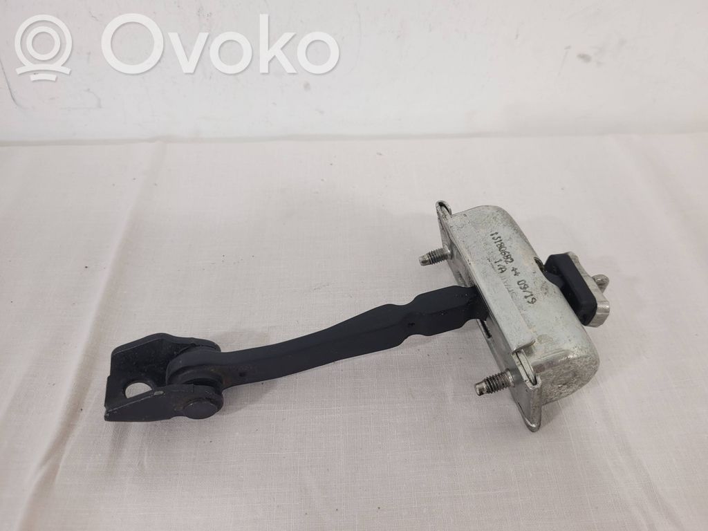 Front door check strap stopper   13180682