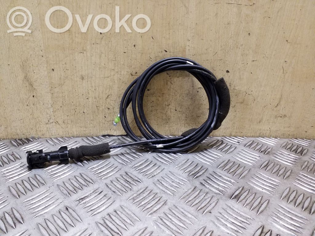 Fuel cap flap release cable
