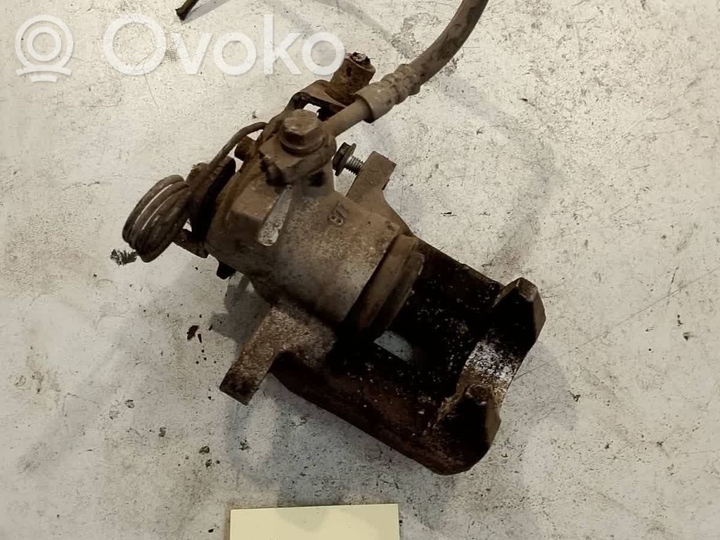 Volkswagen PASSAT B5 Zacisk hamulcowy przedni 