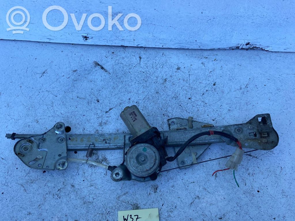 Mazda 626 Elektryczny podnośnik szyby drzwi przednich 