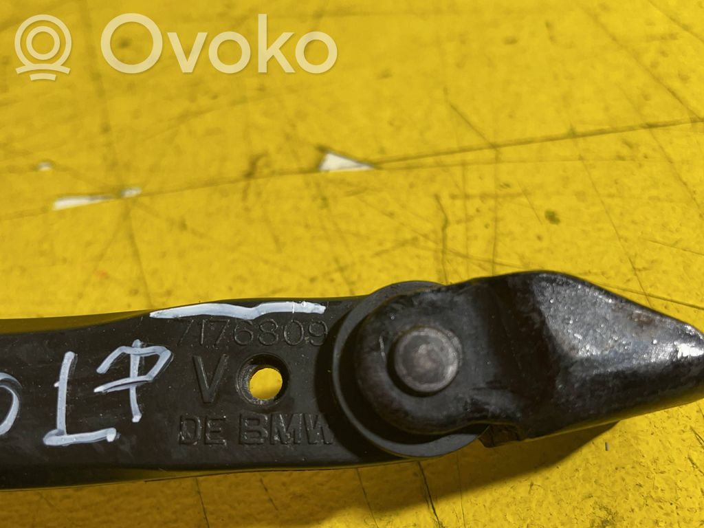Front door check strap stopper   7176809