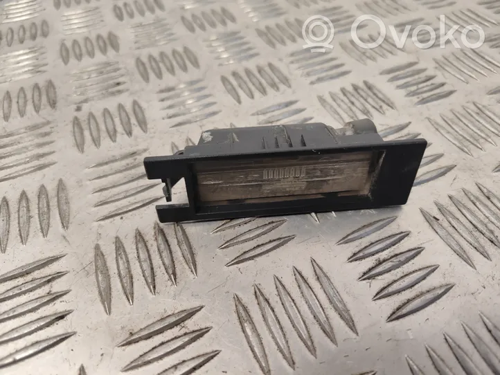 Opel Meriva B Lampa oświetlenia tylnej tablicy rejestracyjnej 0461200