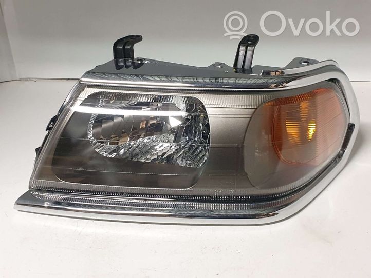 Mitsubishi Pajero Sport I Lampa przednia 