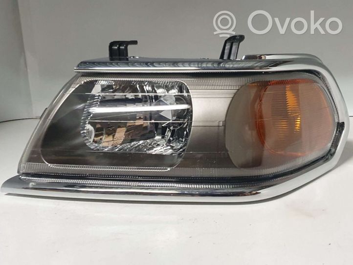 Mitsubishi Pajero Sport I Lampa przednia 