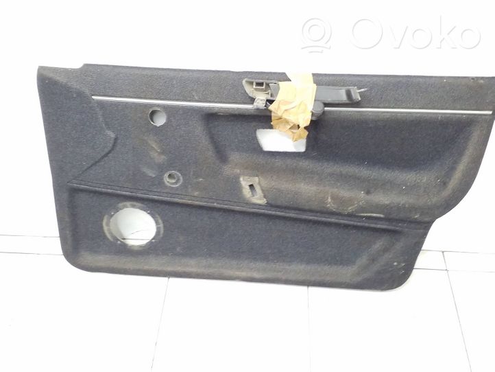 Volkswagen PASSAT B2 Front door card panel trim 323867011q