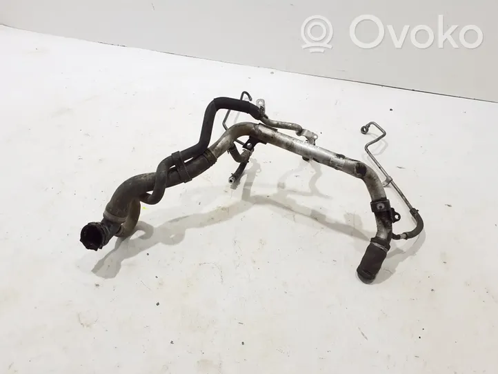 Volkswagen Touareg II Engine coolant pipe/hose 057121071AM