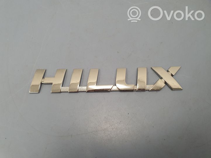 Toyota Hilux (AN120, AN130) Logo portiera di carico posteriore 754270K030