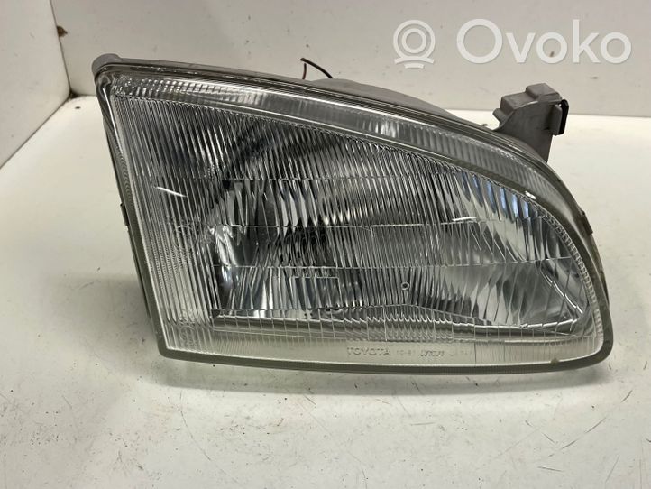 Toyota Starlet (P80) IV Lampa przednia 