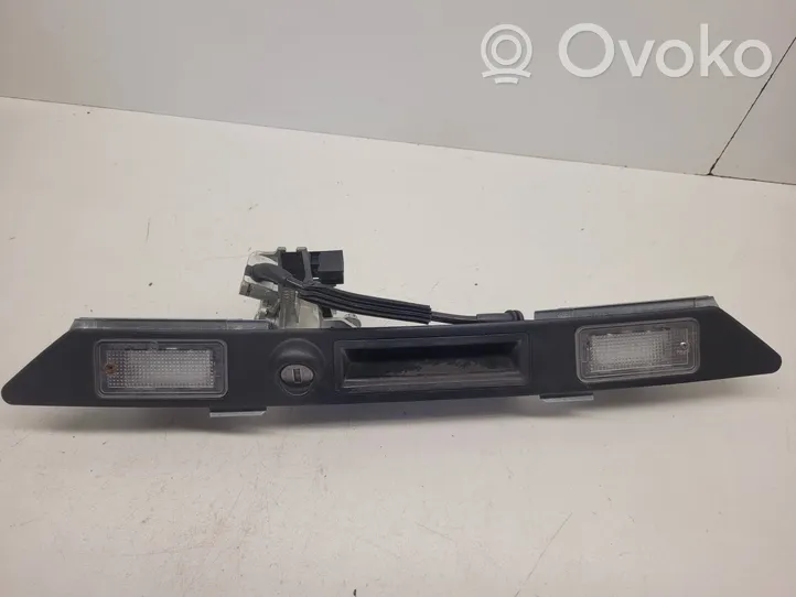 Audi A6 S6 C6 4F Lampa oświetlenia tylnej tablicy rejestracyjnej 8E0827574C