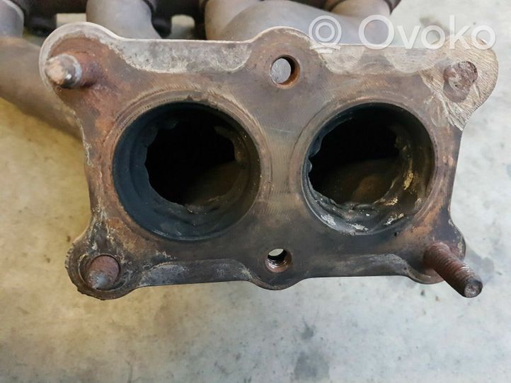 Volkswagen PASSAT B4 Exhaust manifold 037253031BK