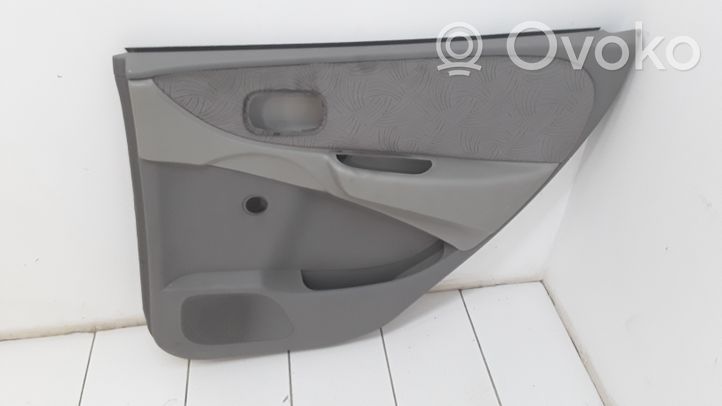 Nissan Almera Tino Garniture panneau de porte arrière 