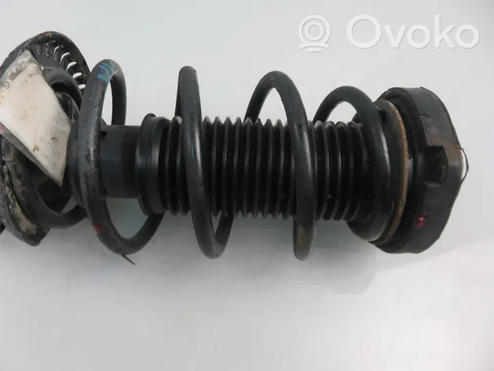 Volkswagen Fox Front shock absorber with coil spring 