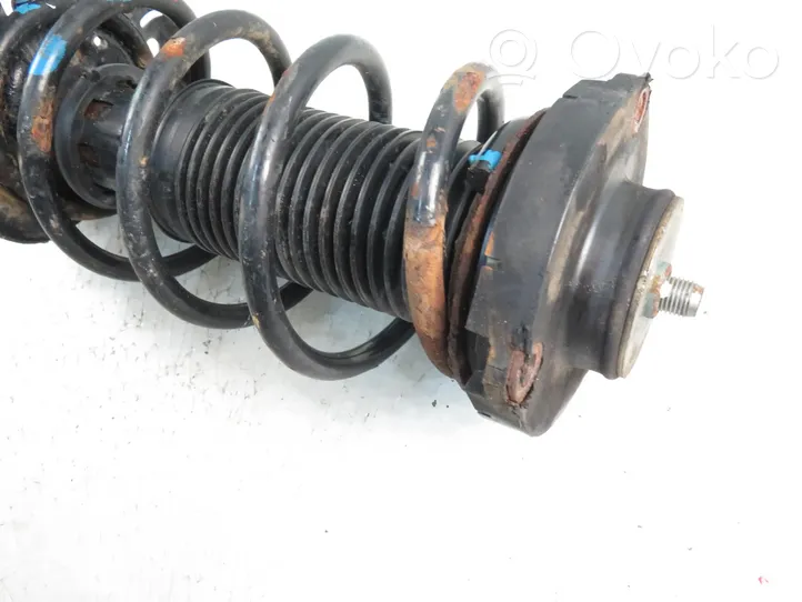 Volkswagen Fox Front shock absorber with coil spring 