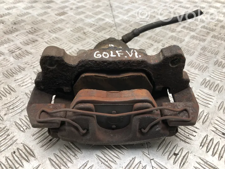 Volkswagen Golf VI Front brake caliper 