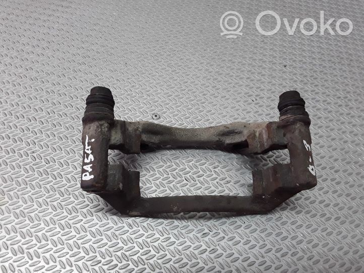 Volkswagen PASSAT B4 Plaquette / support d'étrier avant 