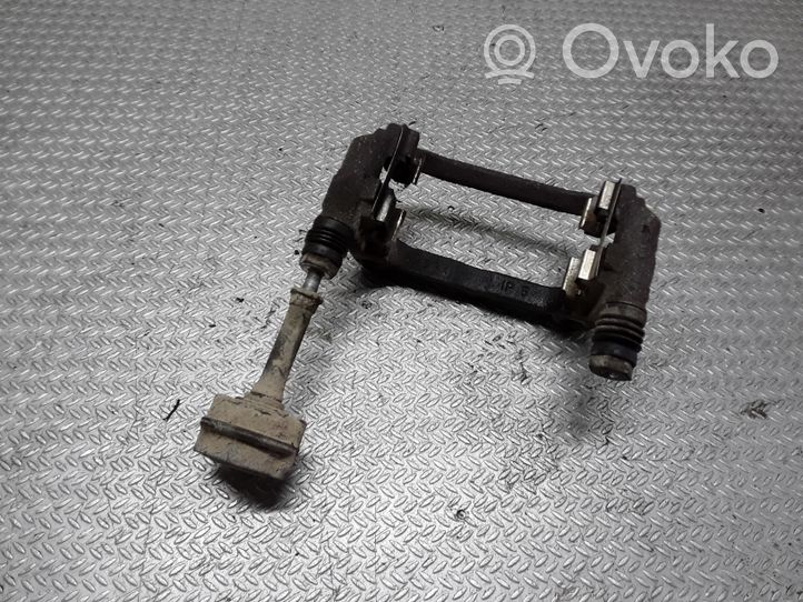 Opel Astra J Supporto della pinza del freno posteriore 