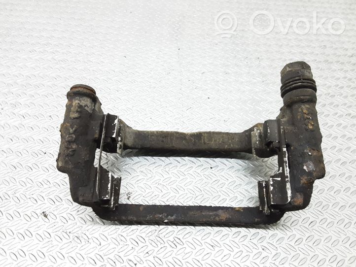 Opel Astra J Supporto della pinza del freno posteriore 