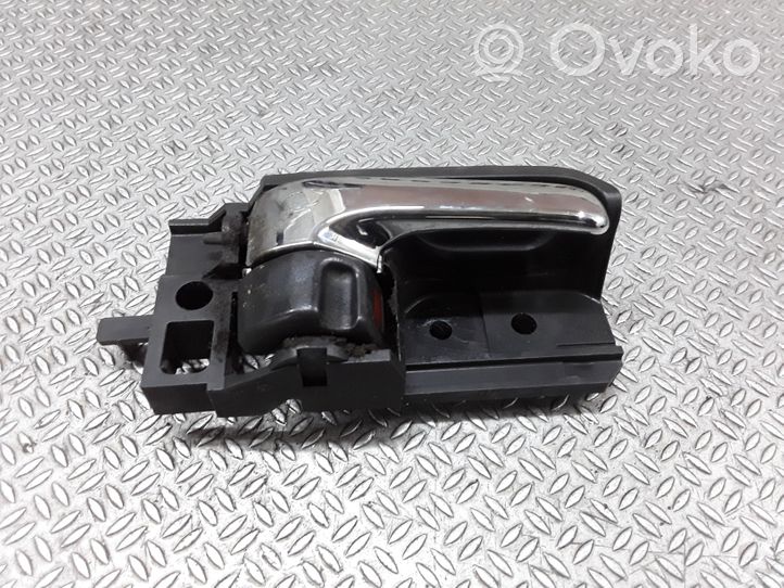 Toyota Avensis T250 Klamka wewnętrzna drzwi przednich 50594A2