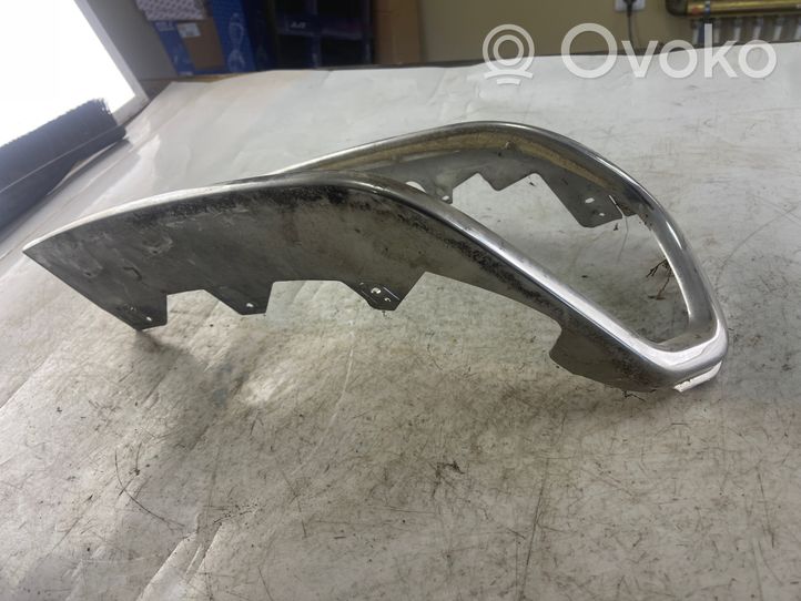 Mitsubishi Pajero Sport I Rivestimento sotto il faro/fanale 10087415