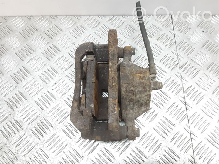 KIA Carens I Caliper de freno delantero 