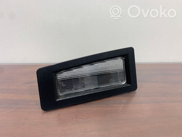 Mazda CX-3 Lampa oświetlenia tylnej tablicy rejestracyjnej 13041979