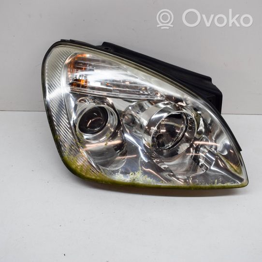 KIA Carens II Lampa przednia 