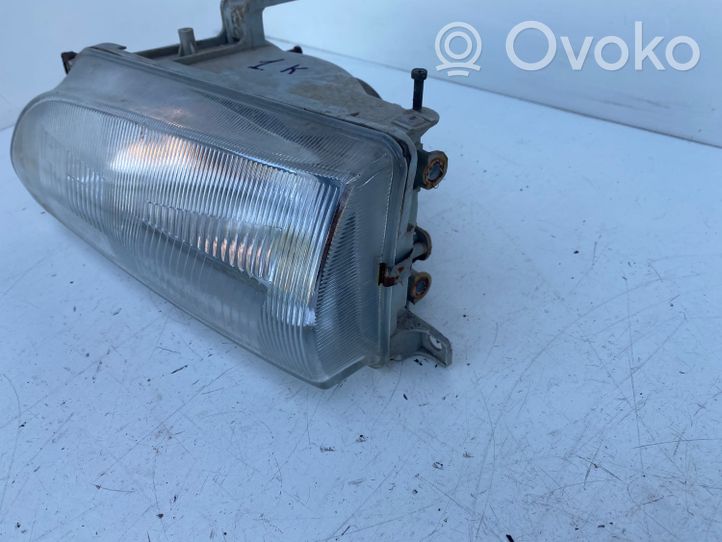 Toyota Corolla E90 Lampa przednia 082121140