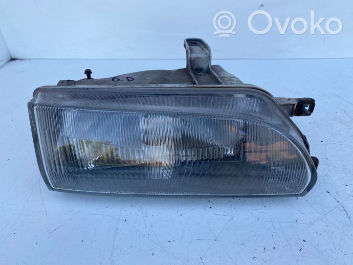 Toyota Corolla E90 Lampa przednia 12307