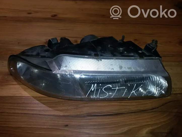 Chrysler Stratus Lampa przednia 04630562